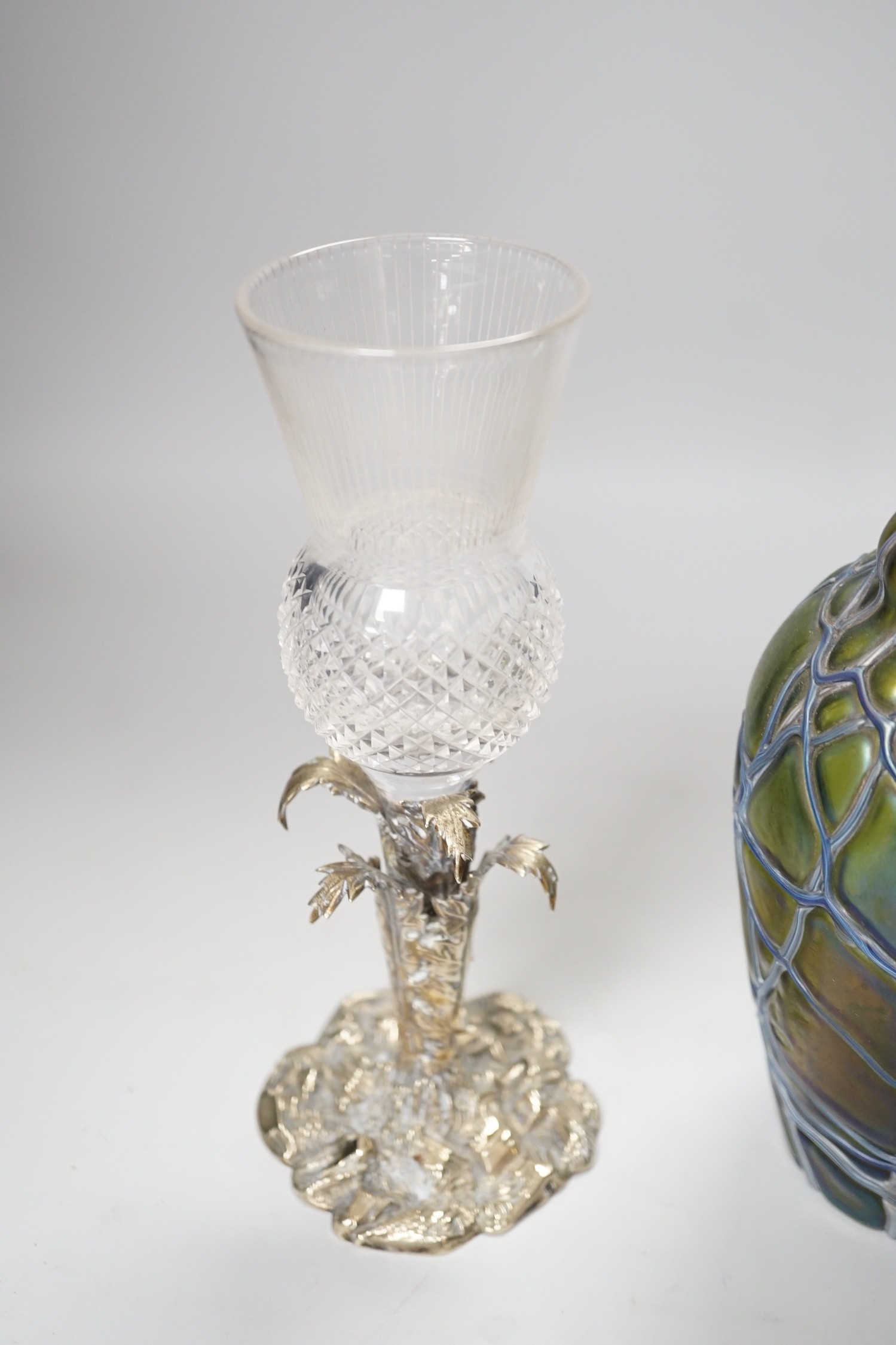 A Victorian thistle vase on cast plated base and a Pallme-Konig Art Nouveau glass vase